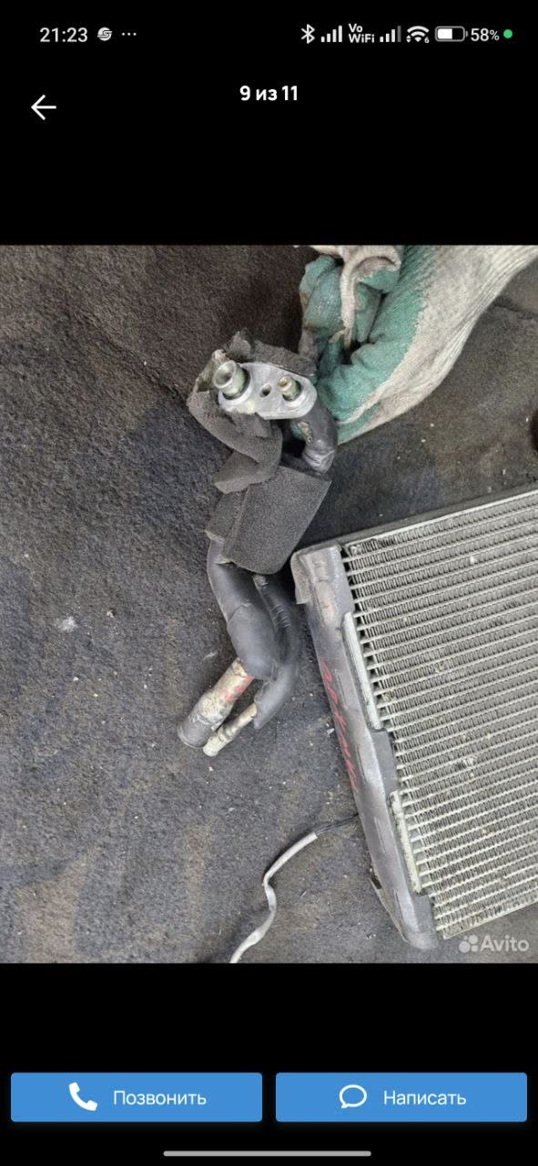 Oil residue marks at a suspected leak point on the refrigerant-line connection