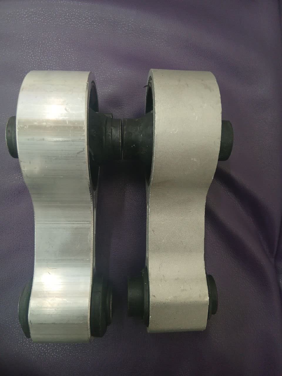 Close-up photo of the deteriorated rear mount rubber prior to replacement