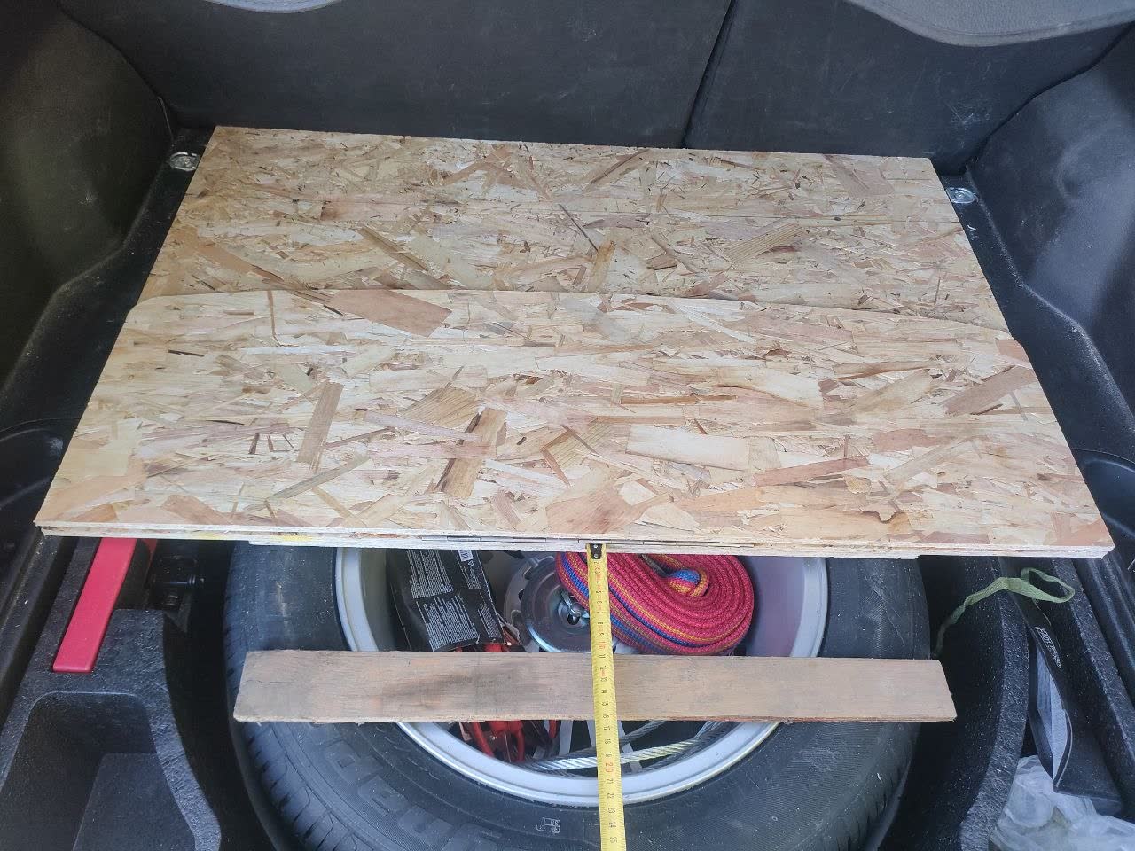 Photo of the backing/reinforcement bars fastened with the same bolts as the hinge