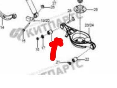 Catalogue-style drawing of a rear suspension arm with items numbered 14-22 and a red arrow on the bushing; watermark KITPARTS