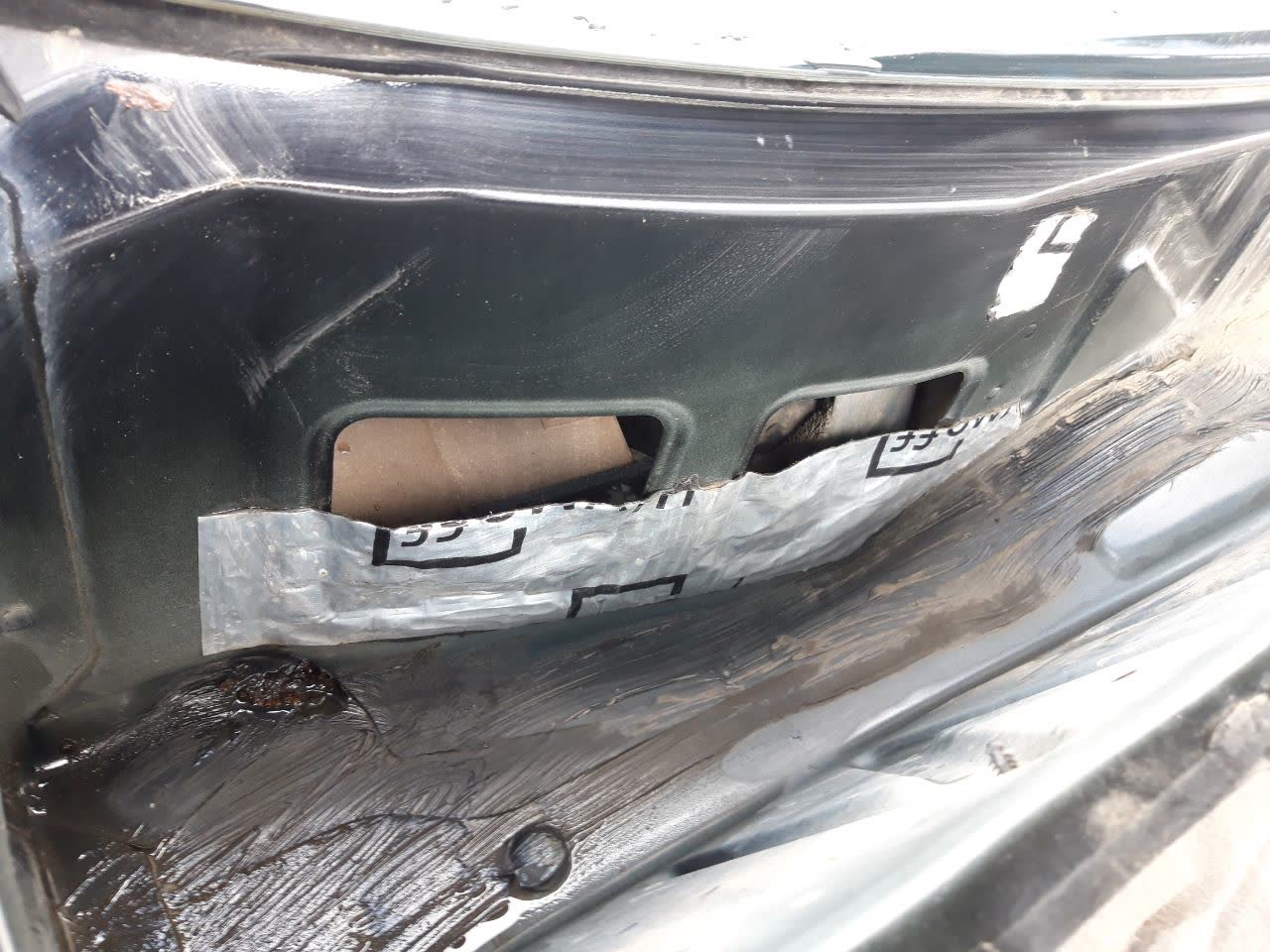 Photo showing sunroof frame area with visible drainage/ventilation holes