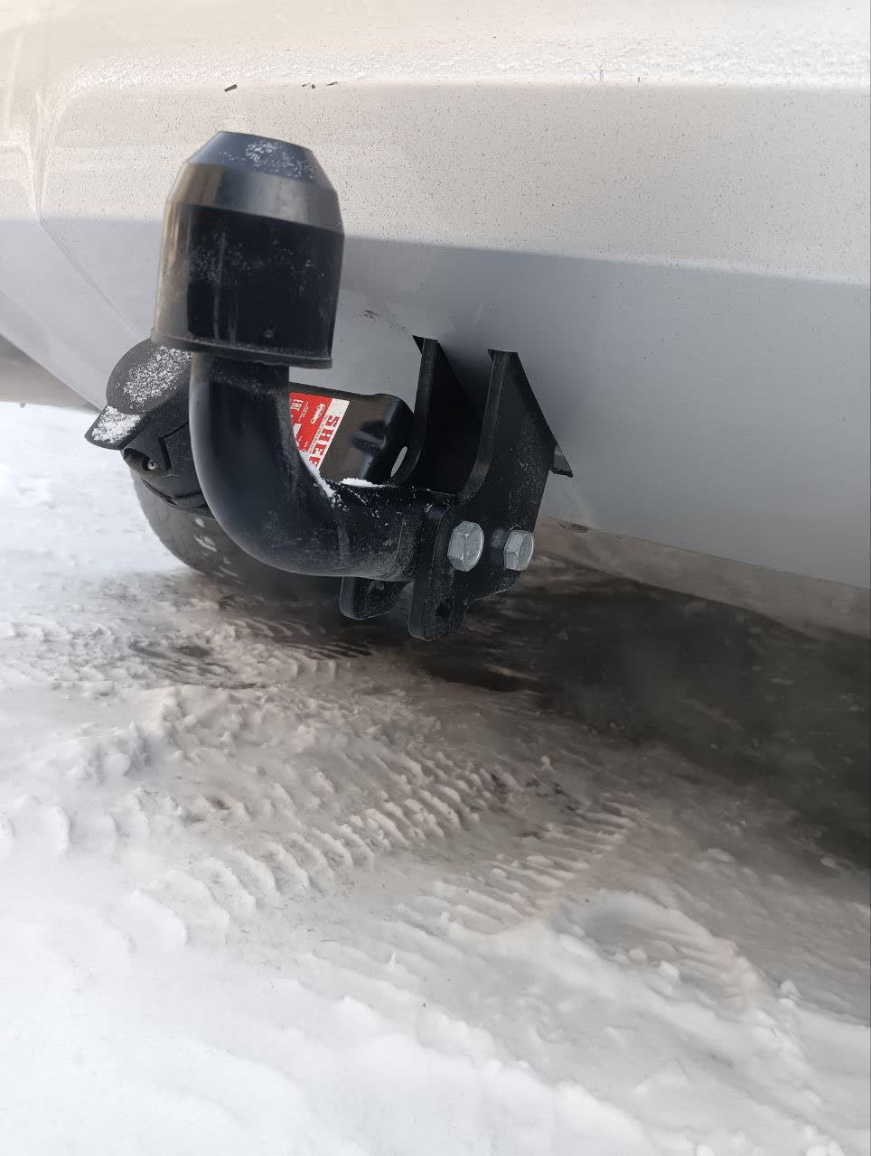 Tow-bar installation method, second angle showing factory mount