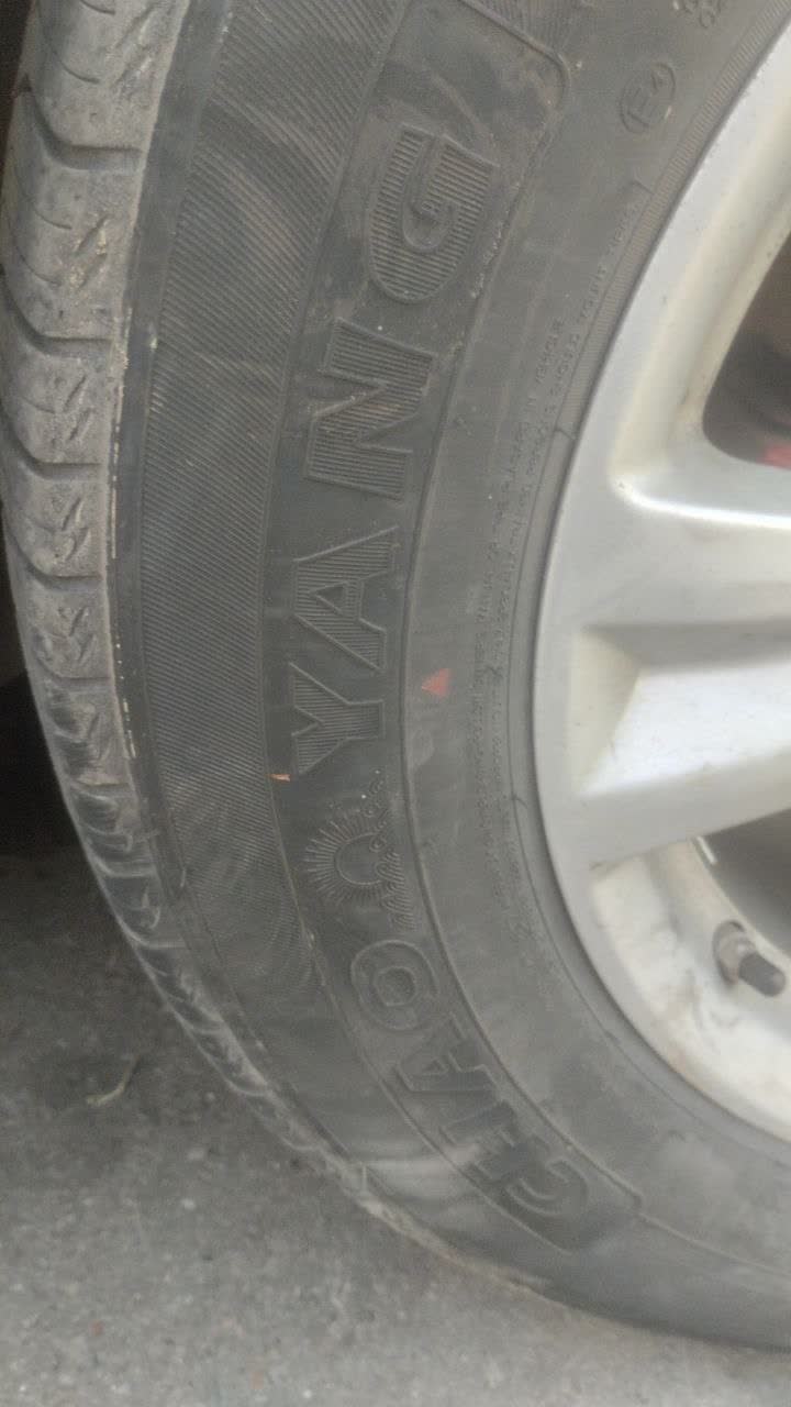 Close-up of a Triangle TC101 Advantex tire showing sidewall markings and tread pattern, later found to be elliptical/imbalanced