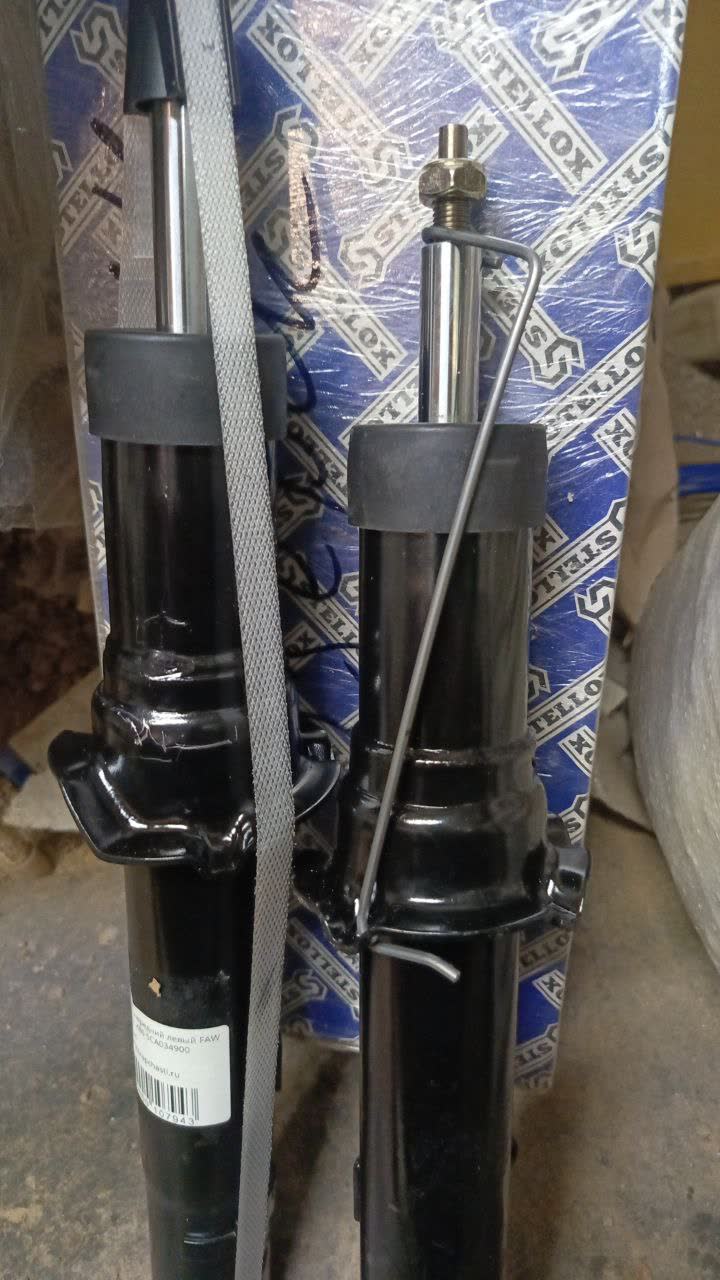 Close-up comparison of paint-finish inconsistency between the two struts