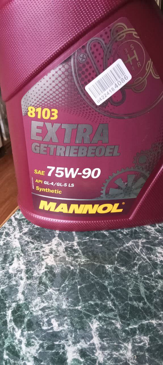 Photo of a transmission oil bottle (Mannol 75W-90) labeled SAE 75W-90, API GL-4/GL-5 LS, synthetic