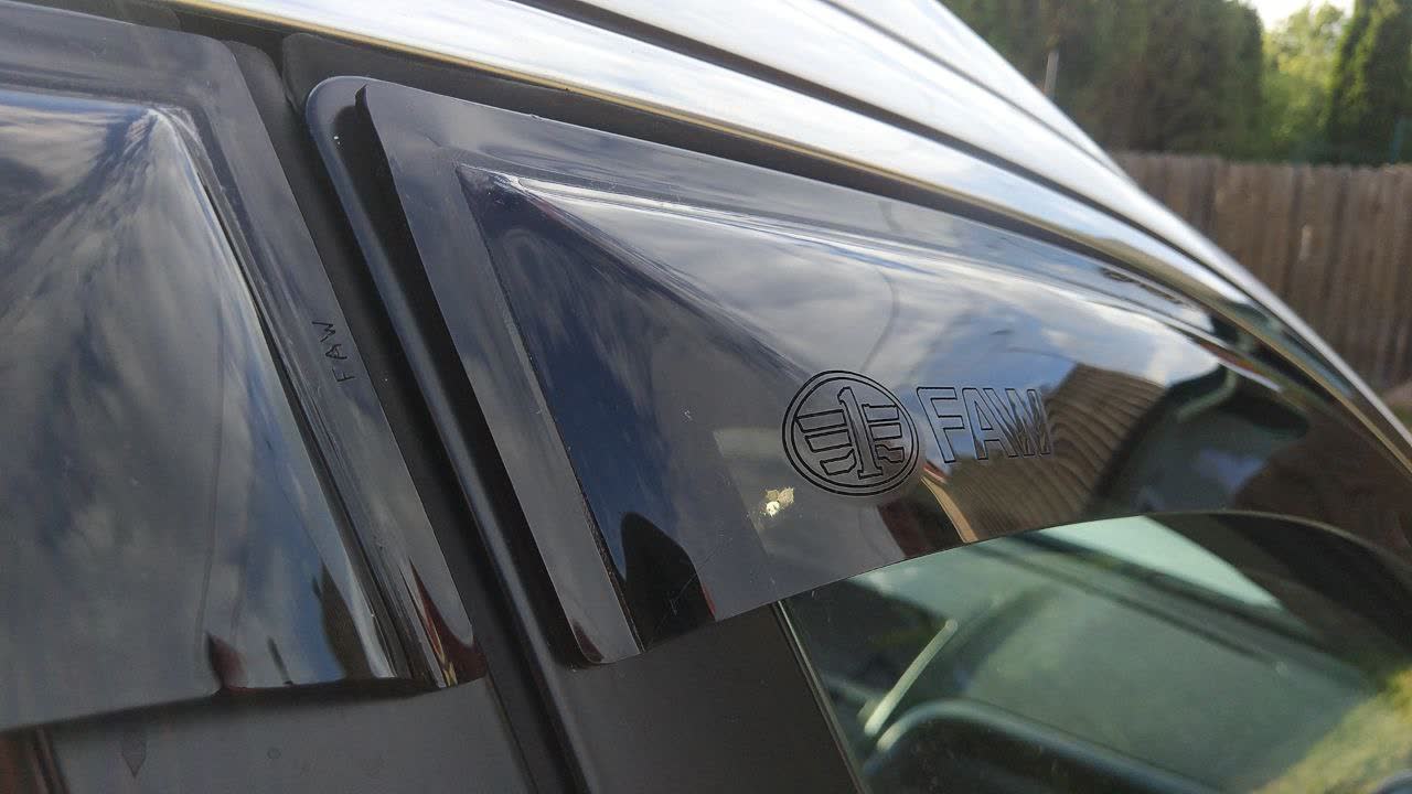 Photo showing the correct FAW1315011 deflector part with factory branding
